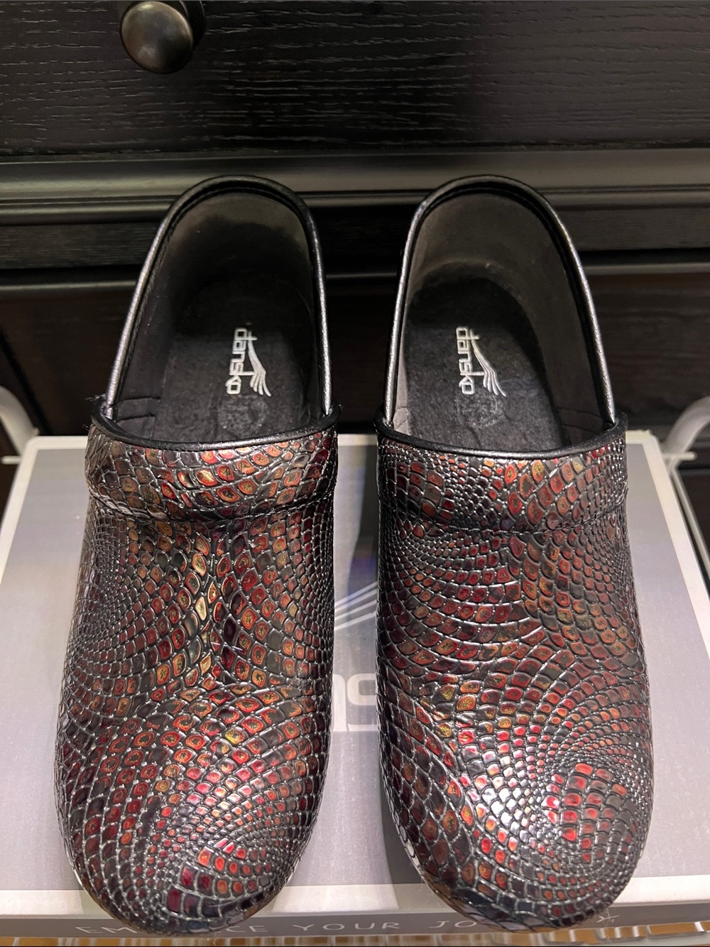 Dansko Men’s Slip-On Clogs in Black and Red-Brown Snake Emboss